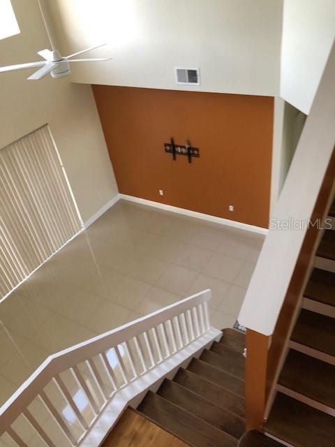 A two-story yellow house with a two-car garage and a concrete driveway — 5359 DAHLIA RESERVE DRIVE, KISSIMMEE, FL