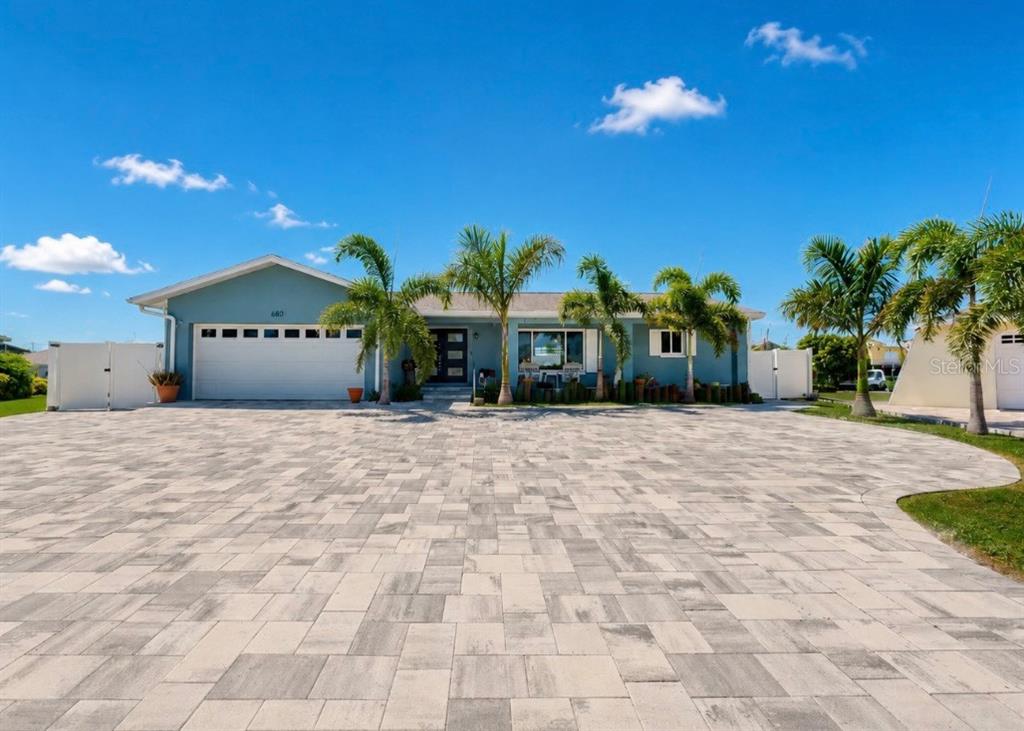Aerial view of a waterfront house on a cul-de-sac lot with a private boat dock — 6301 COTTONWOOD LANE, APOLLO BEACH, FL