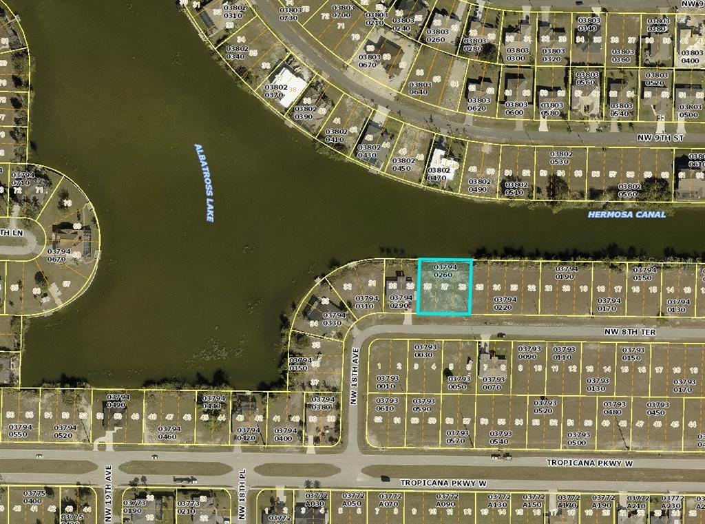 This is a map showing residential property lots and streets near a lake and canal — 1721 NW 8TH TERRACE, CAPE CORAL, FL