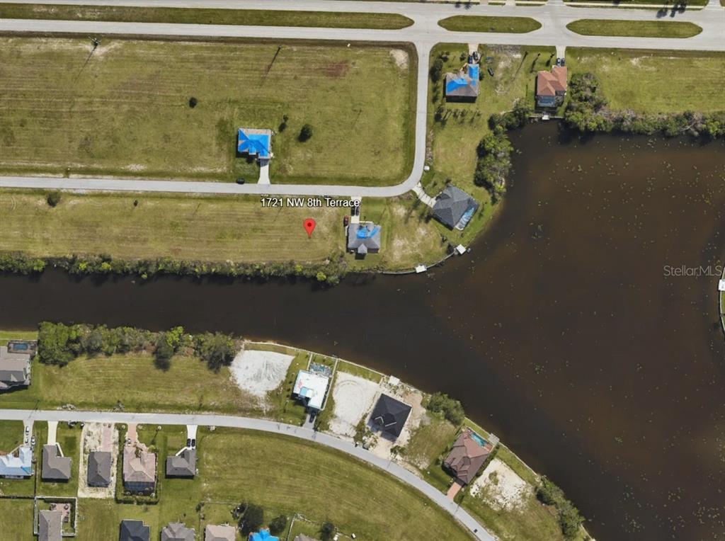 This is an aerial map view of a residential lot located along a canal — 1721 NW 8TH TERRACE, CAPE CORAL, FL