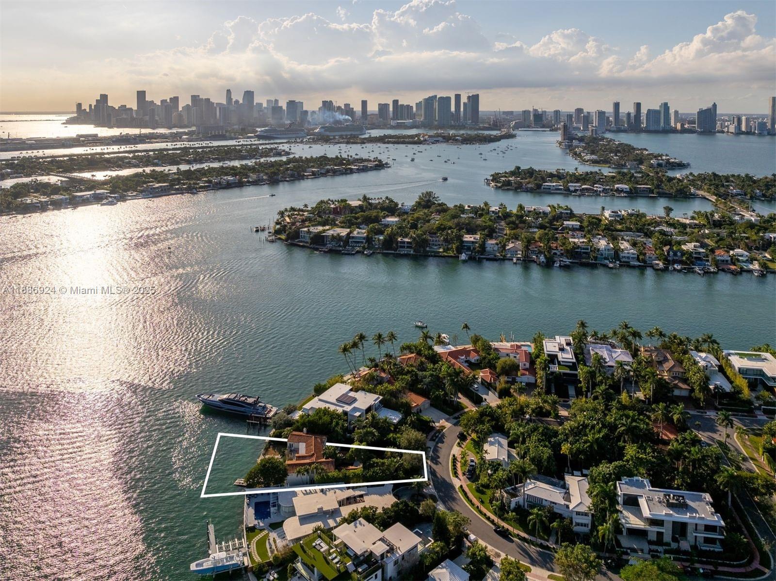 An aerial view shows a waterfront property outlined in white on a residential island — 11 E Rivo Alto Dr, Miami Beach FL 33139, MIAMI BEACH, FL