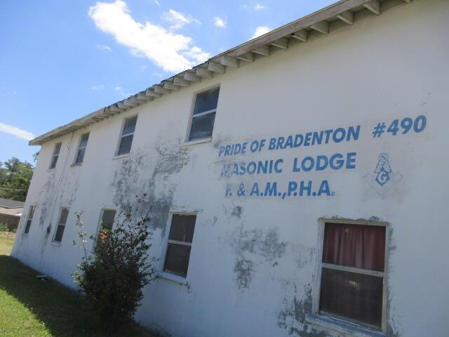 The exterior of a white two-story building with blue signage for a Masonic Lodge — 1203 1st Street E, Bradenton FL 34208, BRADENTON, FL