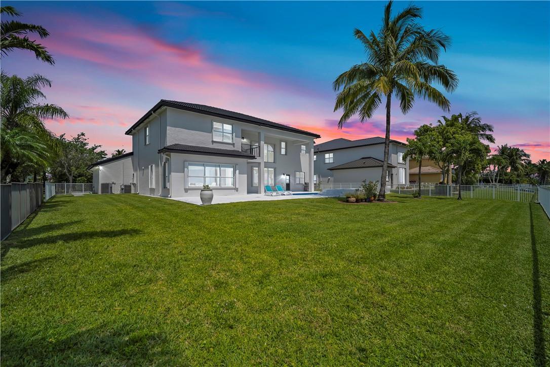 A two-story house with a large backyard, a swimming pool, and a tall palm tree — 4707 SW 195th Terrace, Miramar FL 33029, MIRAMAR, FL