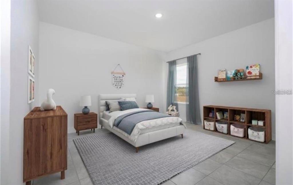 A bedroom features a bed, a wooden dresser, a bookshelf, and a gray area rug — 267 MARION OAKS GOLF ROAD, OCALA, FL