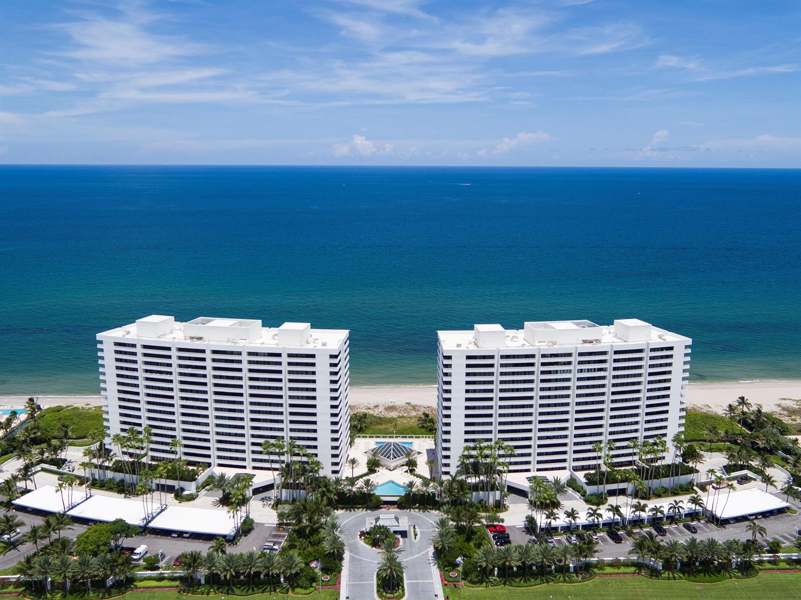 An aerial view of two white high-rise residential buildings situated on a sandy beach — 1400 S Ocean Boulevard # 103, Boca Raton FL 33432, BOCA RATON, FL