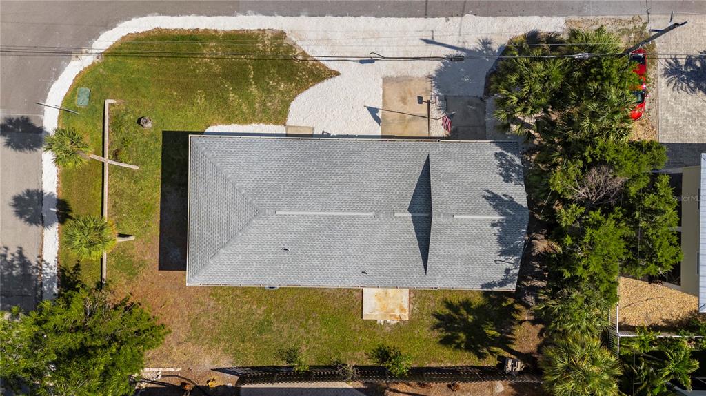 An aerial view shows a rectangular house with a gray shingled roof and surrounding yard — 204 29TH STREET, HOLMES BEACH, FL