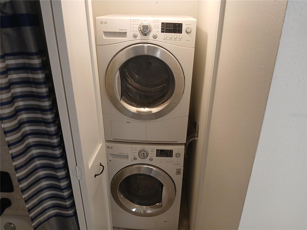 A stacked LG washer and dryer unit is installed in a small closet — 1245 S MARTIN LUTHER KING JR AVENUE UNIT 104, CLEARWATER, FL