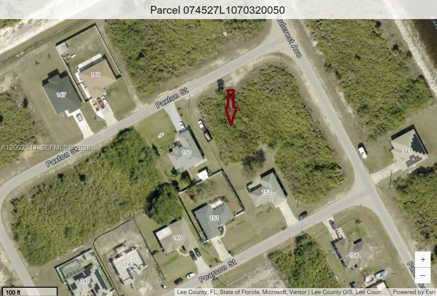 This is an aerial map showing a vacant residential lot marked with a red arrow — 152 Paxton St, Lehigh Acres FL 33974, LEHIGH ACRES, FL