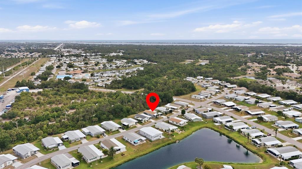 An aerial view shows a residential neighborhood with a red pin marking a specific house — 807 SEABROOKE DRIVE, ENGLEWOOD, FL