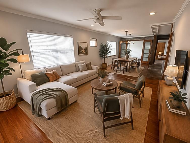 A living room with a sectional sofa, two armchairs, a coffee table, and dining area — 2121 IVANHOE ROAD, ORLANDO, FL