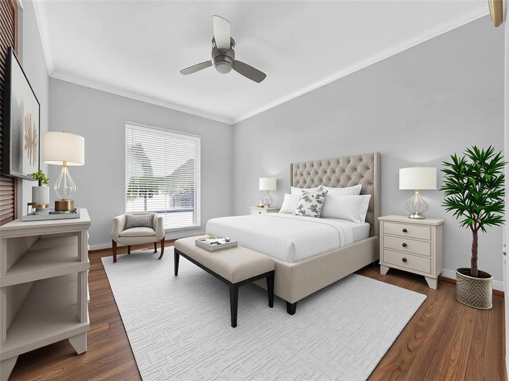 A bedroom features a tufted headboard, a bench, a ceiling fan, and light-colored wood flooring — 2121 IVANHOE ROAD, ORLANDO, FL