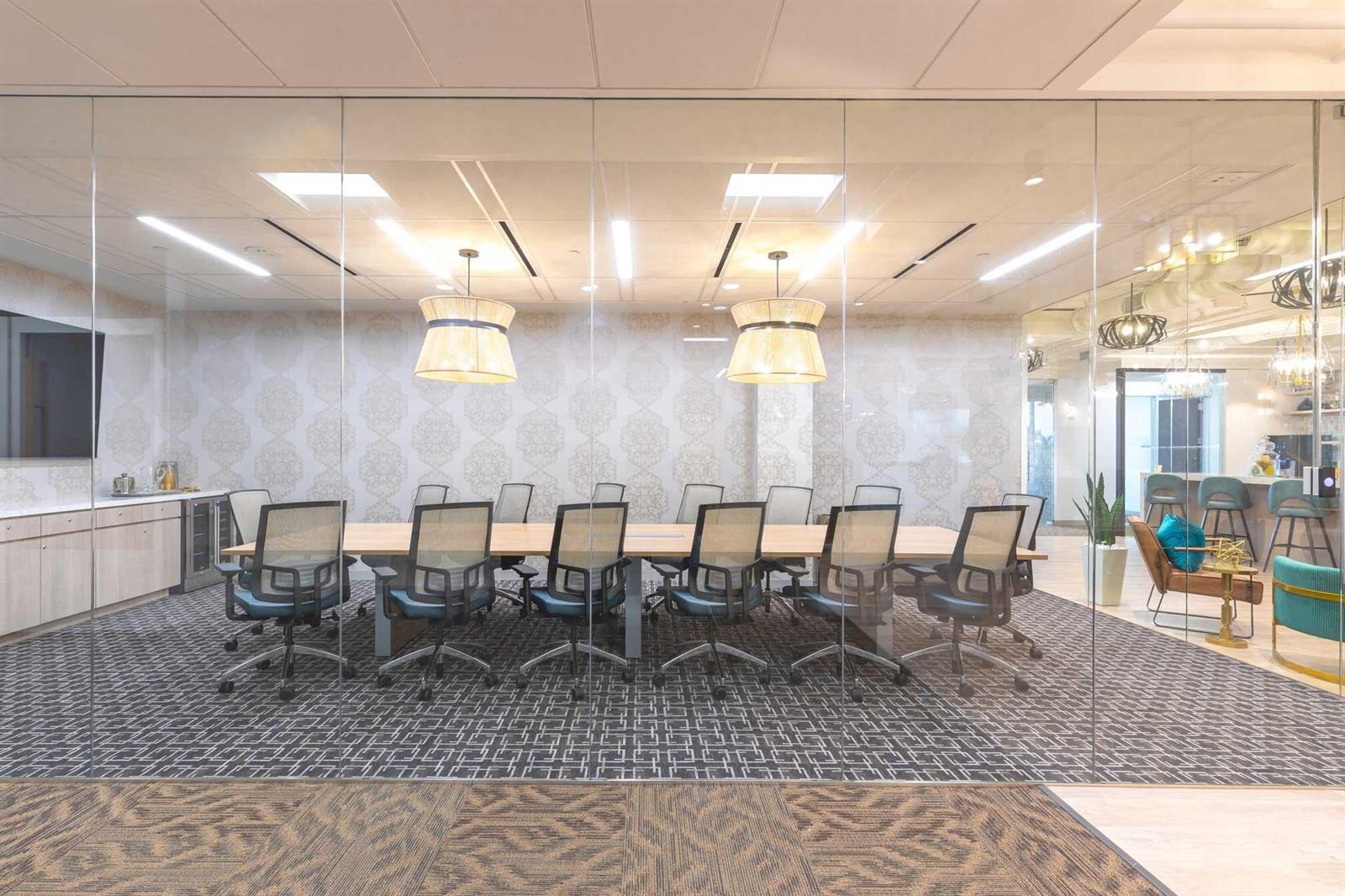 A glass-walled conference room features a long table, mesh chairs, and patterned wallpaper — 1200 N Federal, Boca Raton FL 33432, BOCA RATON, FL
