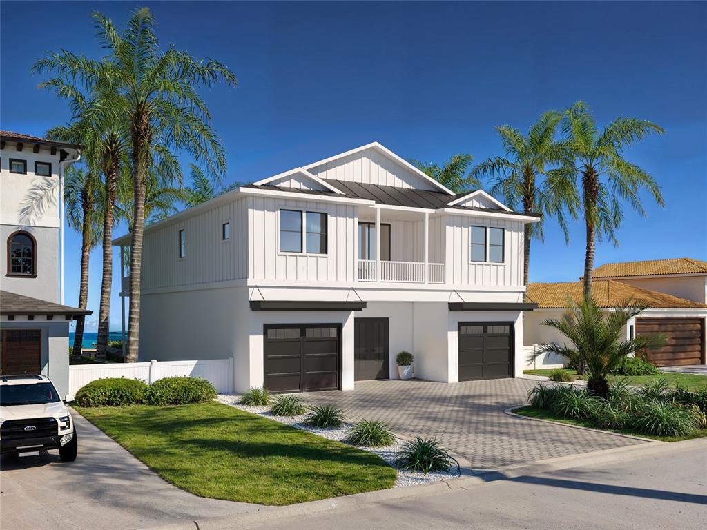 This is a digital rendering of a two-story white house with two garages — 17030 DOLPHIN DRIVE, NORTH REDINGTON BEACH, FL
