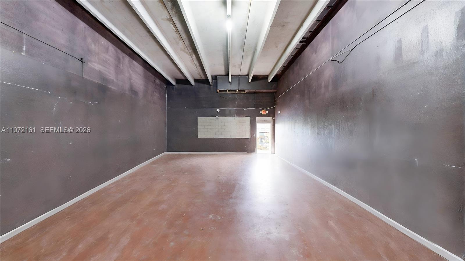 An unfinished commercial interior features exposed concrete ceilings, ductwork, and block walls — 27332-34 S Dixie Hwy, Miami FL 33032, MIAMI, FL