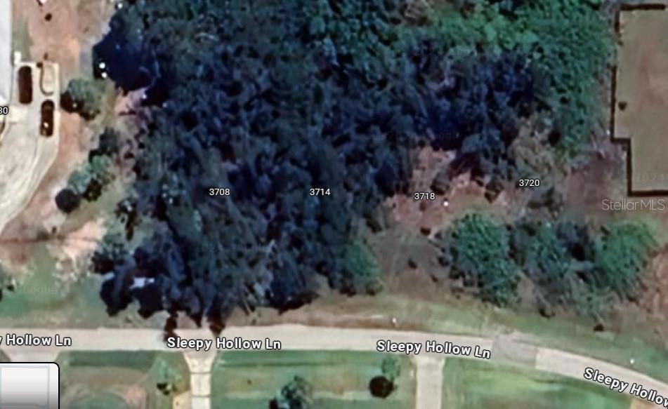 This aerial map shows four adjacent vacant wooded lots along a residential street — 3714 SLEEPY HOLLOW LANE, PUNTA GORDA, FL