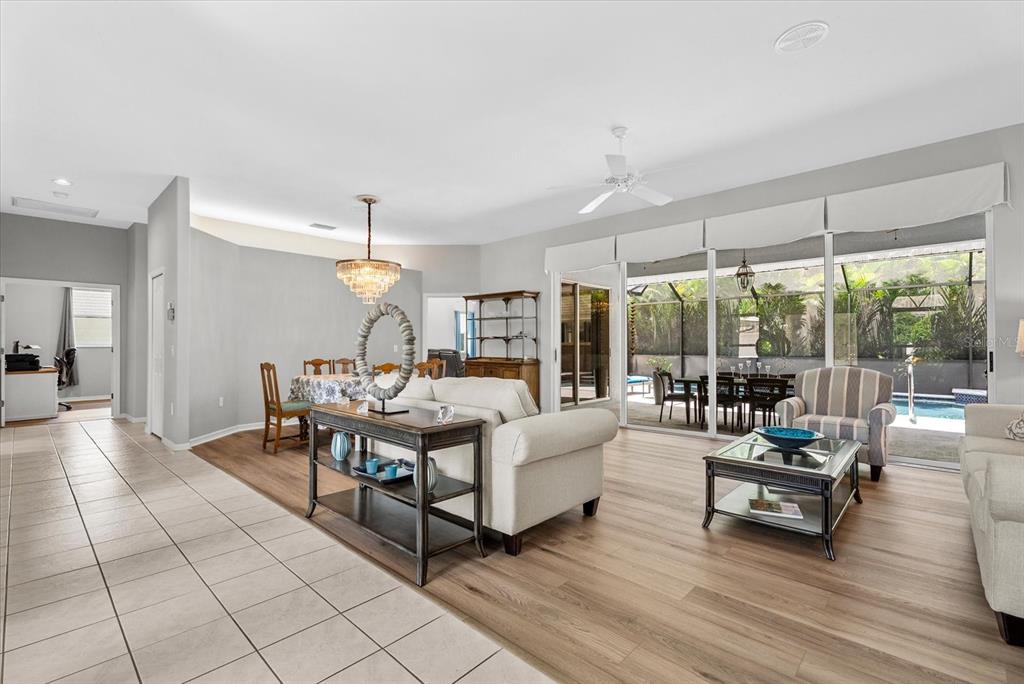 A bright entryway features double glass-paneled doors, arched windows, and light-colored tile flooring — 288 VENICE GOLF CLUB DRIVE, VENICE, FL