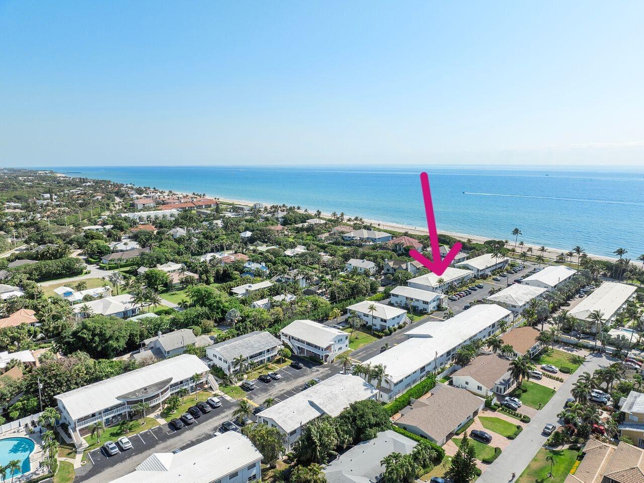 An aerial view shows a multi-story apartment complex near a beach and ocean — 5505 N Ocean Boulevard # 204, Ocean Ridge FL 33435, OCEAN RIDGE, FL