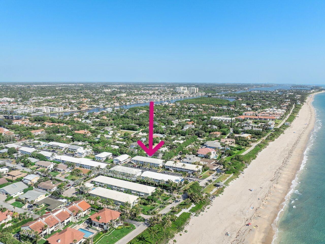 An aerial view of a coastal residential complex with a pink arrow pointing toward buildings — 5505 N Ocean Boulevard # 204, Ocean Ridge FL 33435, OCEAN RIDGE, FL