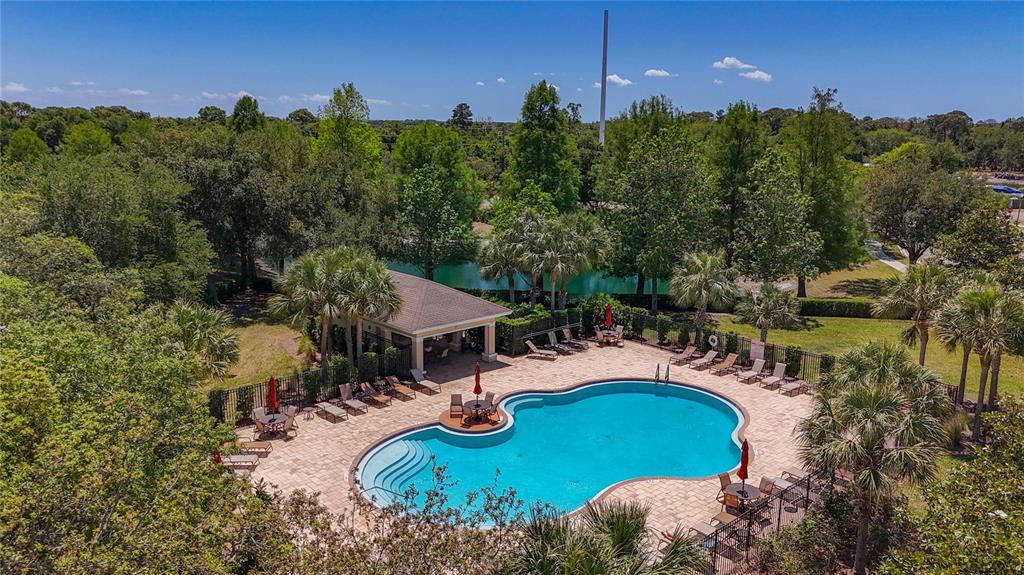 This floor plan shows a single-story home layout with a garage, three bedrooms, and a patio — 1027 ORCA COURT, HOLIDAY, FL