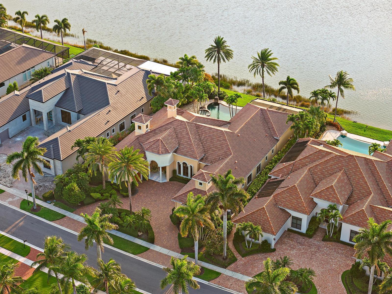An aerial view of a large Mediterranean-style house with a tile roof and swimming pool — 7287 Horizon Drive, West Palm Beach FL 33412, WEST PALM BEACH, FL