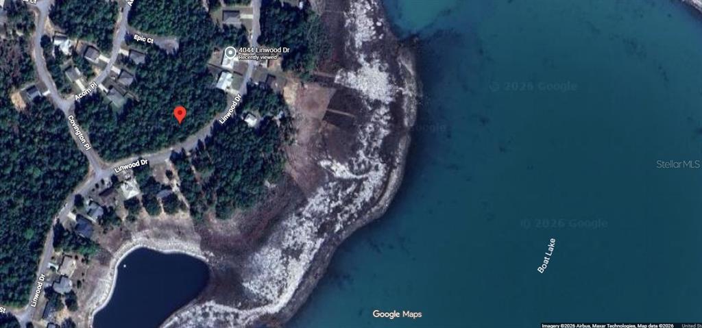 This is a satellite map view showing a wooded residential lot near a large lake — Lot 23, Unit 19, Blk 1096 LINWOOD DRIVE, CHIPLEY, FL