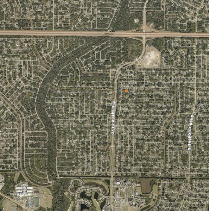 This aerial map shows a residential neighborhood with a highlighted property lot — DESCO ROAD, NORTH PORT, FL