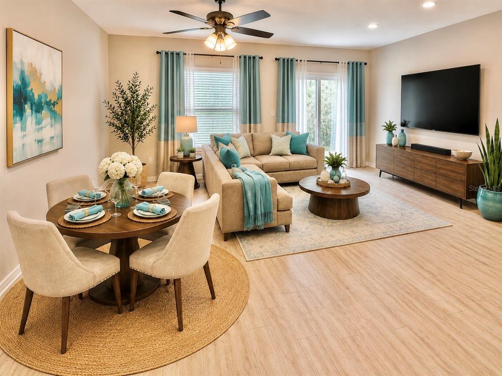 An open-concept living and dining area features light wood floors, neutral furniture, and teal accents — 302 CEDAR BARK LANE, SANFORD, FL