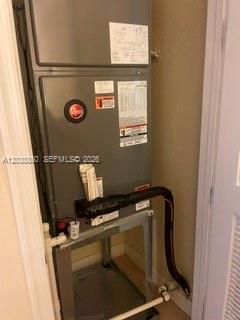 A gray HVAC air handler unit is installed inside a small utility closet — 3837 Aspen Leaf Dr, Boynton Beach FL 33436, BOYNTON BEACH, FL