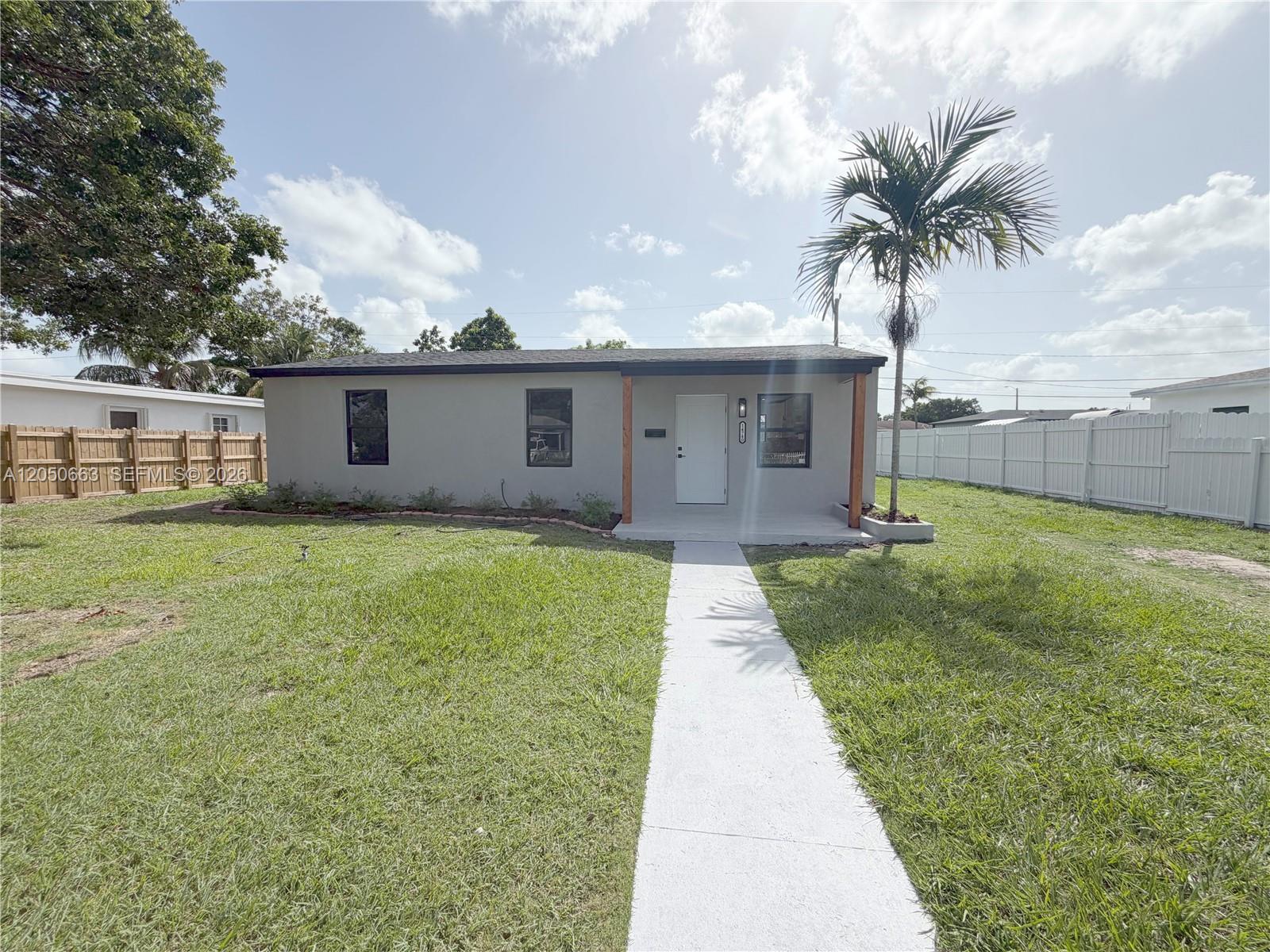 A single-story gray house with a white front door and a concrete walkway — 14740 Polk St, Miami FL 33176, MIAMI, FL