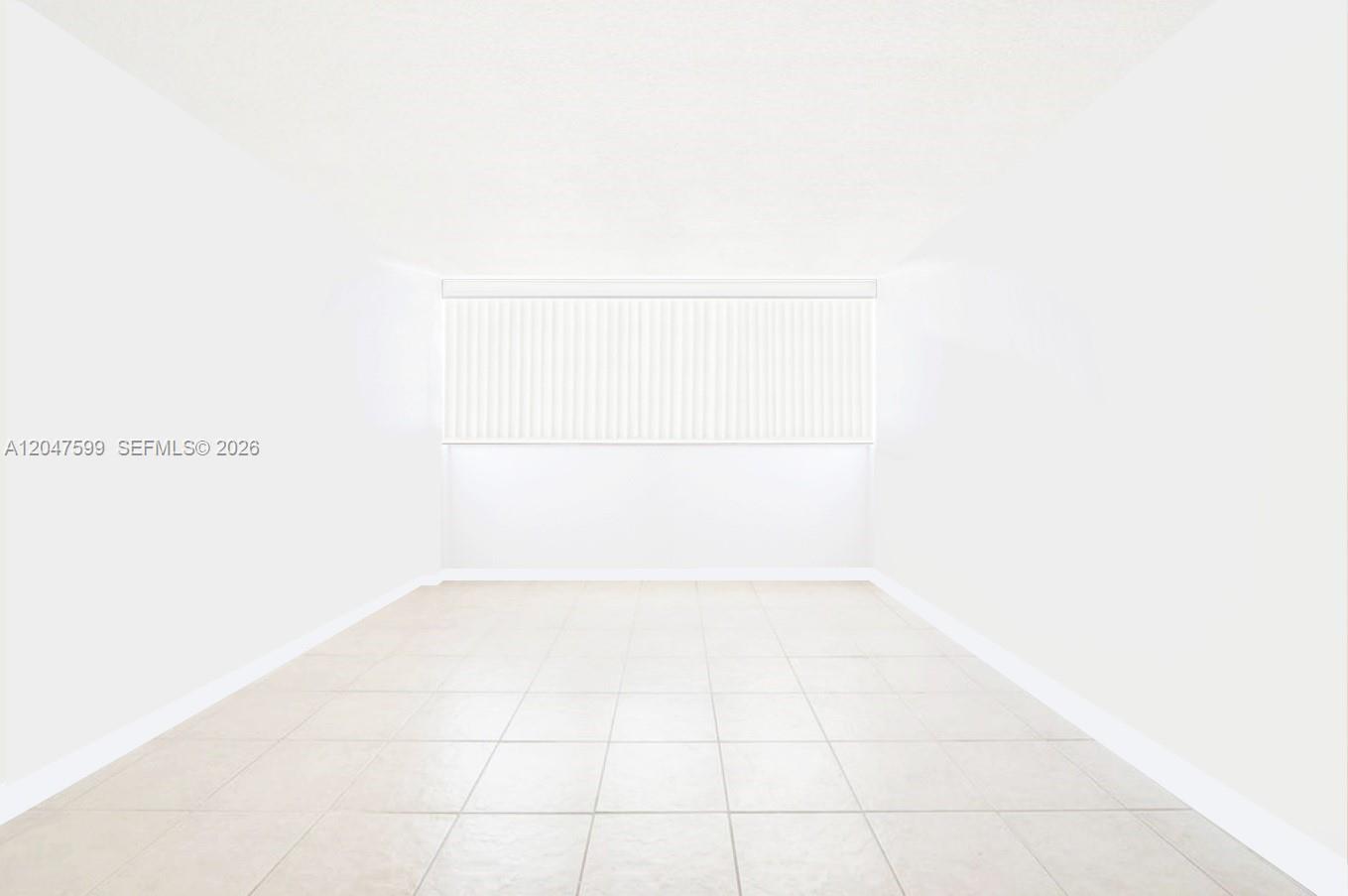 An empty room features white walls, a large window with vertical blinds, and tiled flooring — 13155 Ixora Ct # 310, North Miami FL 33181, NORTH MIAMI, FL