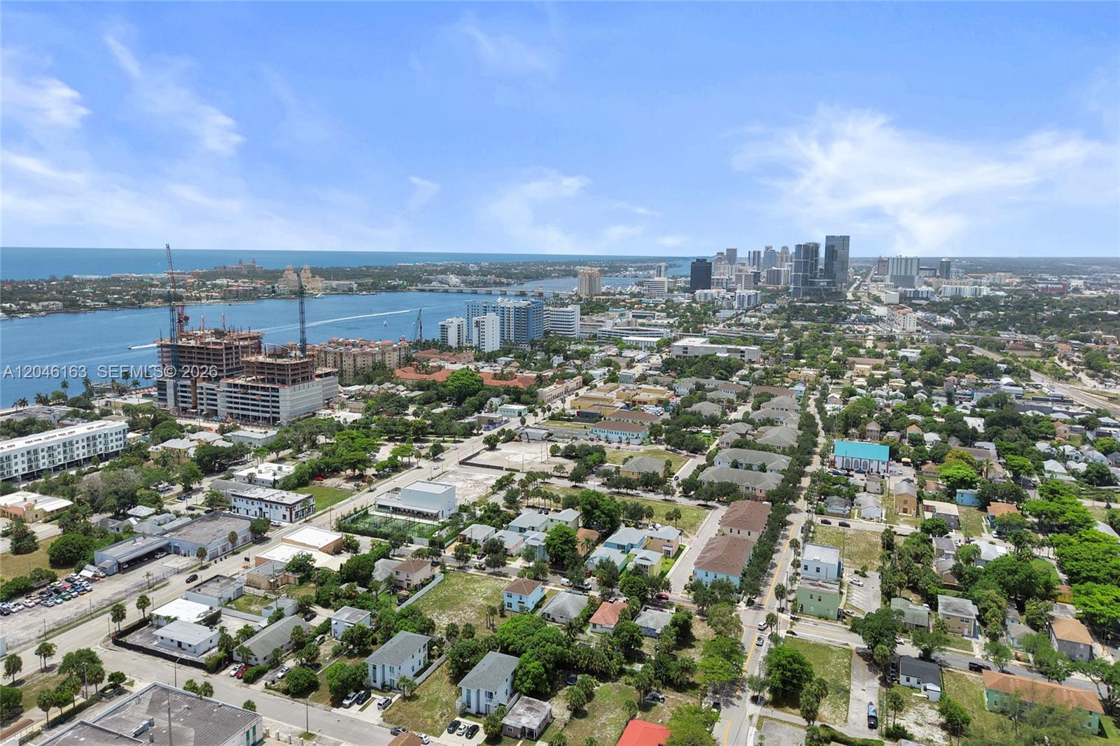An aerial view shows a coastal city with a construction site near the water — 727 22nd St # A, West Palm Beach FL 33407, WEST PALM BEACH, FL