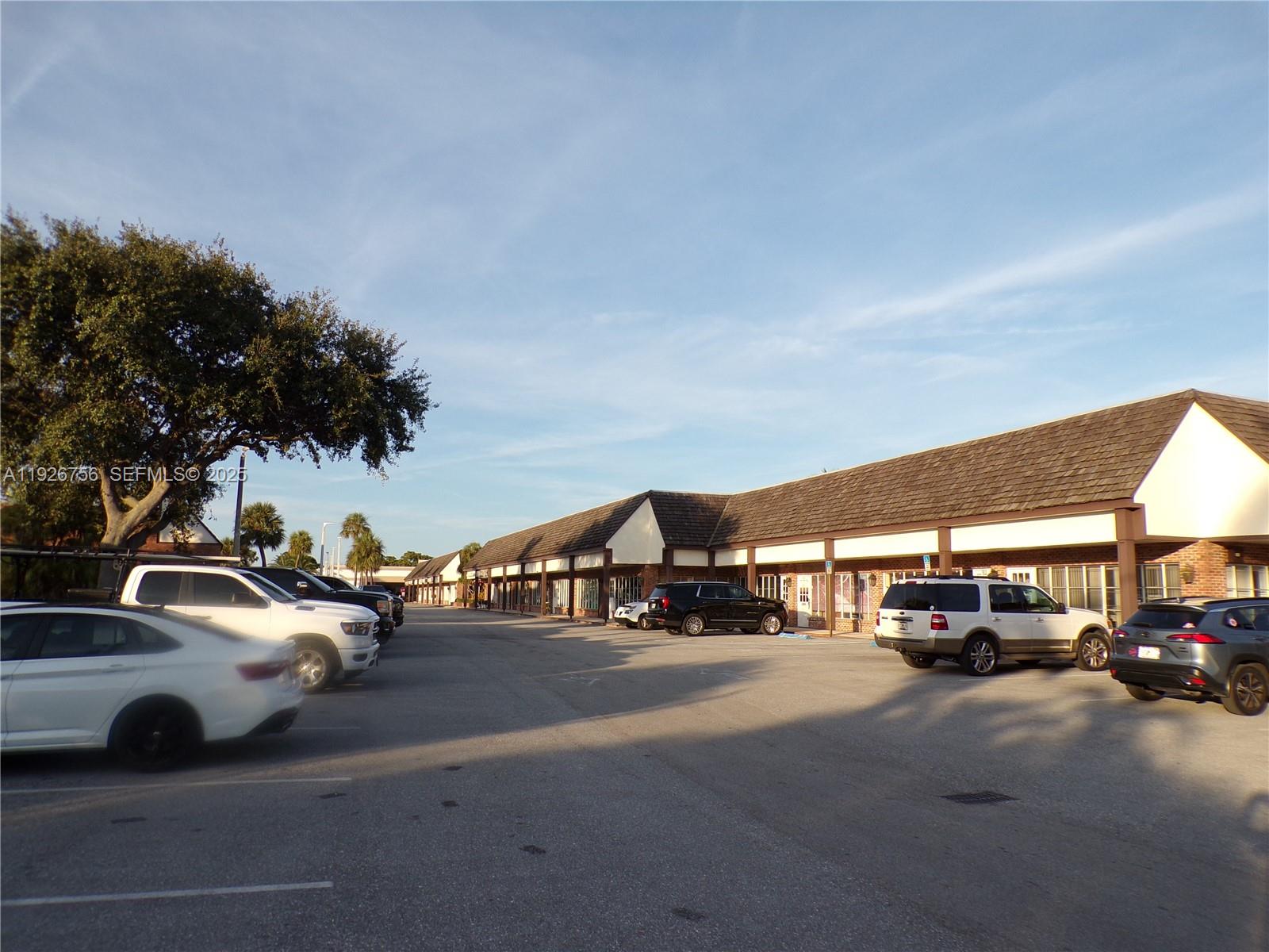 A parking lot sits in front of a long, single-story commercial strip mall building — 5030 N Federal Hwy, Lighthouse Point FL 33064, LIGHTHOUSE POINT, FL
