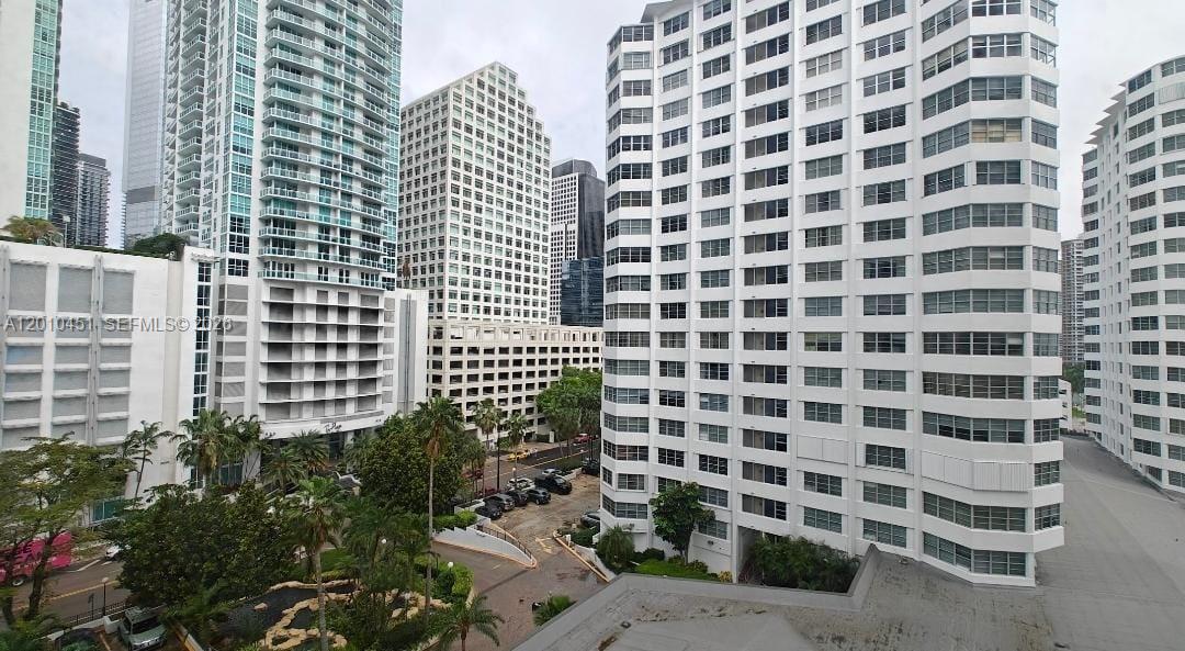 An elevated view of several high-rise apartment buildings and a parking structure in a city — 999 Brickell Bay Dr # 805, Miami FL 33131, MIAMI, FL