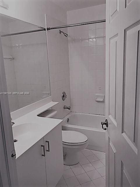 A bathroom features a white vanity, a toilet, and a shower-tub combination with white tiles — 6731 NW 107th Ct # 6731, Doral FL 33178, DORAL, FL