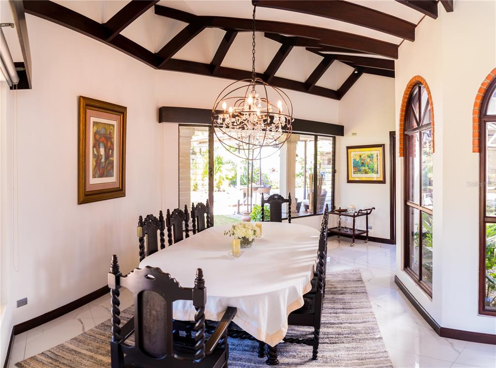 A dining room features a vaulted beamed ceiling, a crystal chandelier, and dark wooden chairs — 84 URBANIZACION DE RIO ORO, SANTA ANA, OC
