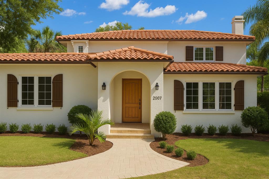 A two-story house with a stucco exterior, red tile roof, and a front entryway — 2217 BREVARD ROAD NE, ST PETERSBURG, FL
