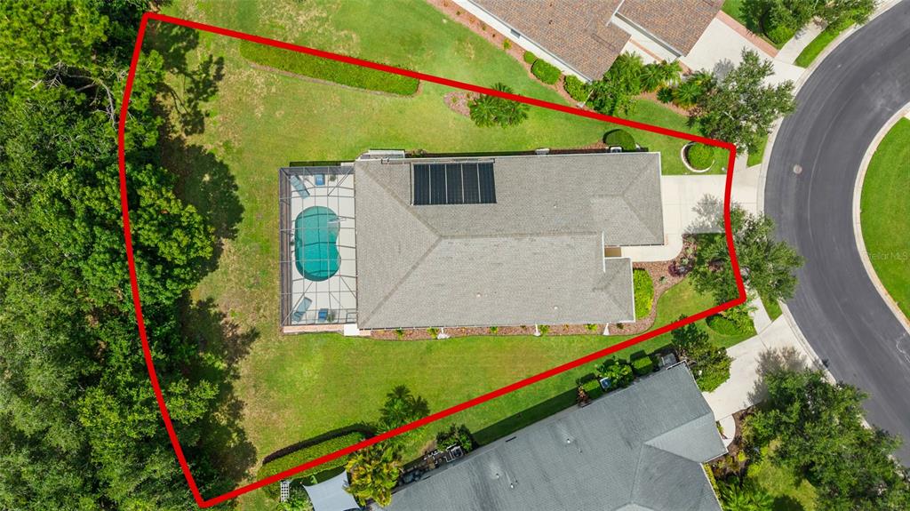 An aerial view shows a house with a pool enclosure on a large corner lot — 11739 FENNEMORE WAY, PARRISH, FL