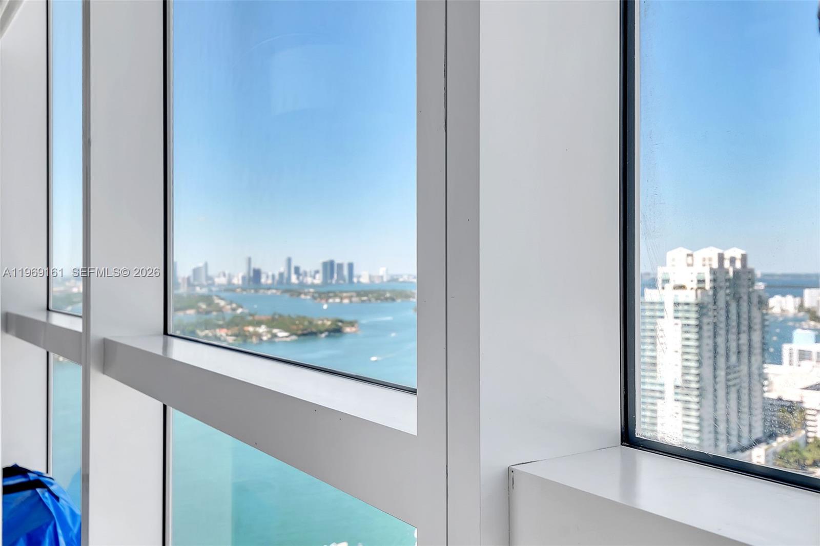 Floor-to-ceiling windows offer a panoramic view of the ocean, islands, and city skyline — 450 Alton Rd # 3208, Miami Beach FL 33139, MIAMI BEACH, FL