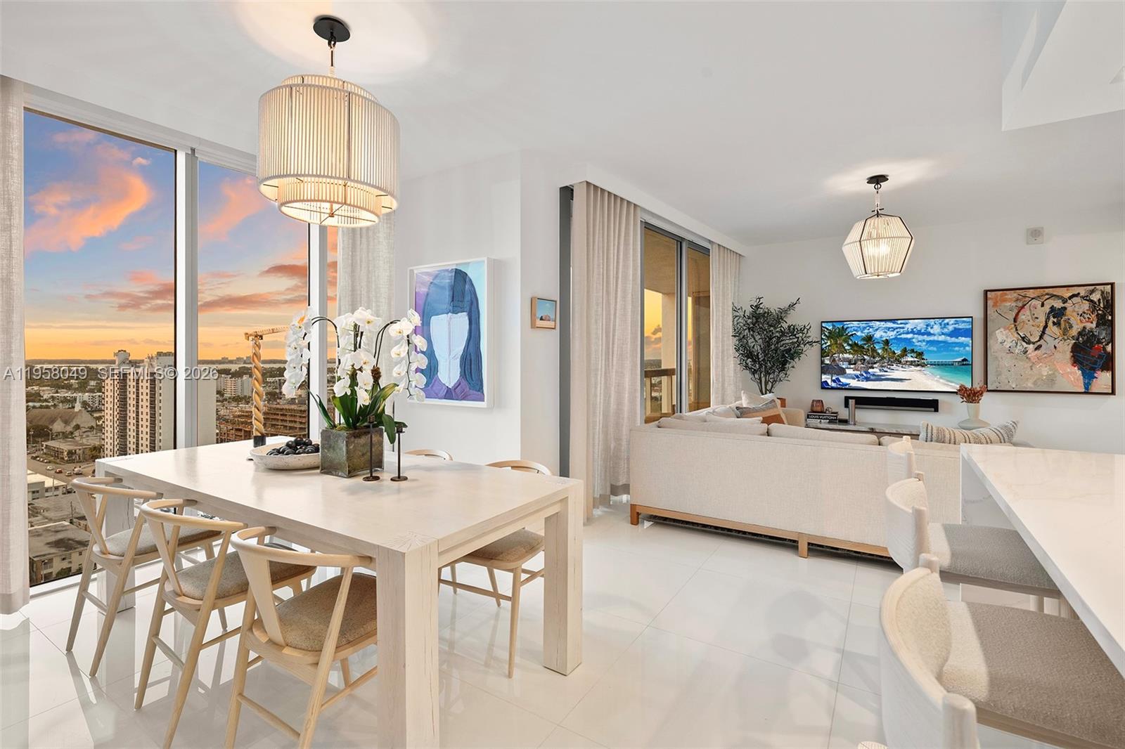 A bright, modern living and dining area features white tile floors, floor-to-ceiling windows, and contemporary furniture — 6899 Collins Ave # 1810, Miami Beach FL 33141, MIAMI BEACH, FL