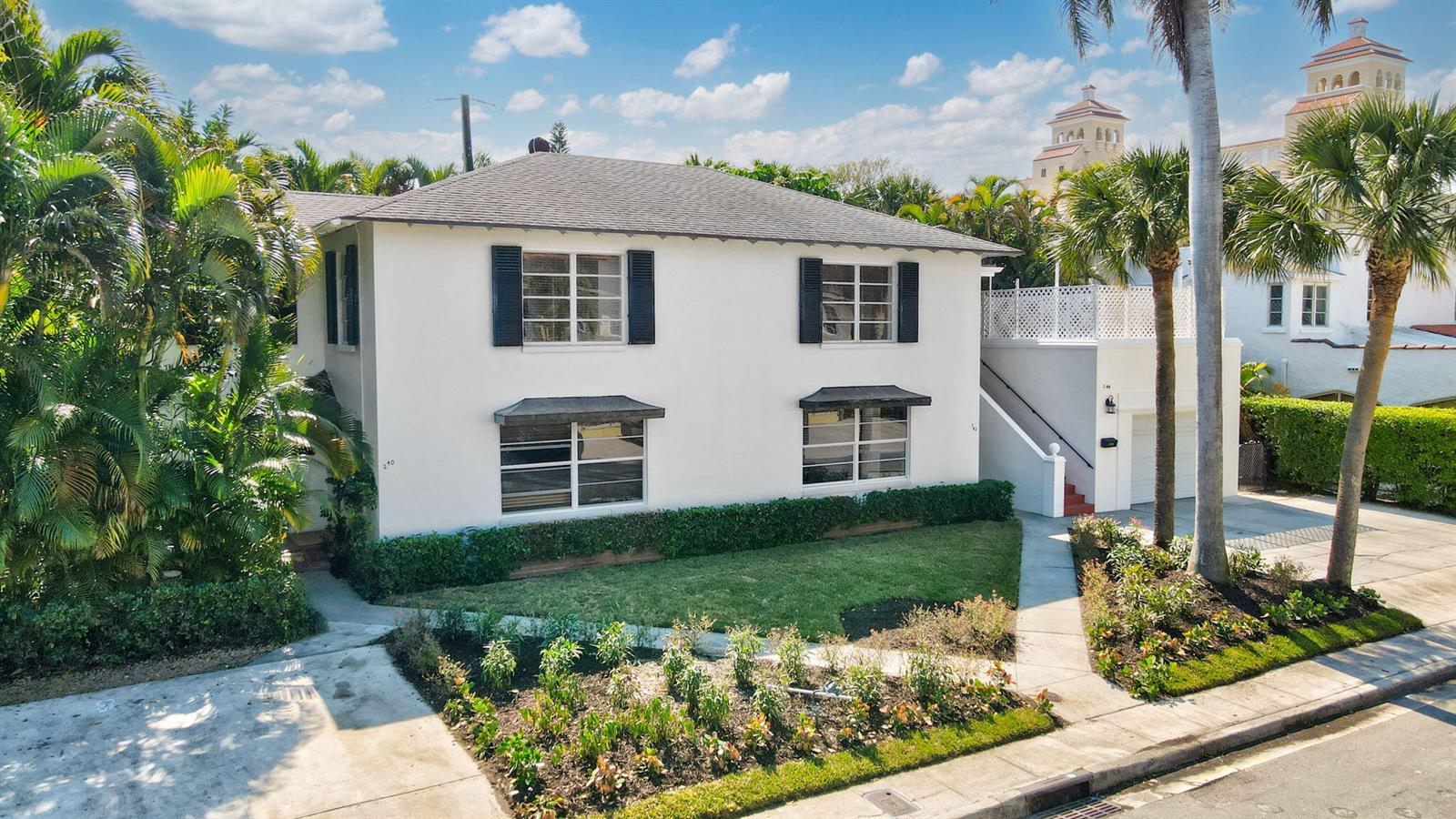 A two-story white house with a hip roof, dark shutters, and a front lawn — 240 Oleander Avenue, Palm Beach FL 33480, PALM BEACH, FL