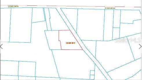 This is a tax map showing a highlighted parcel of land near a road — 100 W STATE LINE ROAD, CENTURY, FL