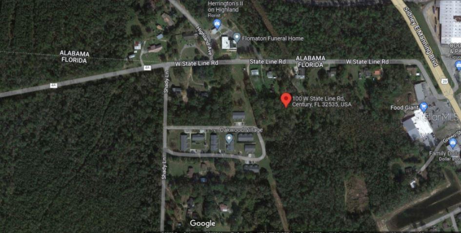 This is a satellite map view showing a residential area near a state border — 100 W STATE LINE ROAD, CENTURY, FL
