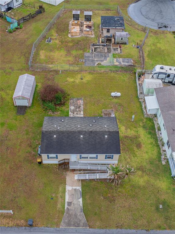 An aerial view shows a house with a ramp, a shed, and a fenced backyard — 2308 KAY STREET, LAKE ALFRED, FL
