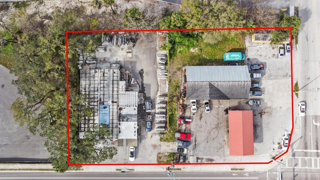 An aerial view shows two commercial buildings with parking lots and outdoor storage areas — 3550 N 40TH STREET, TAMPA, FL