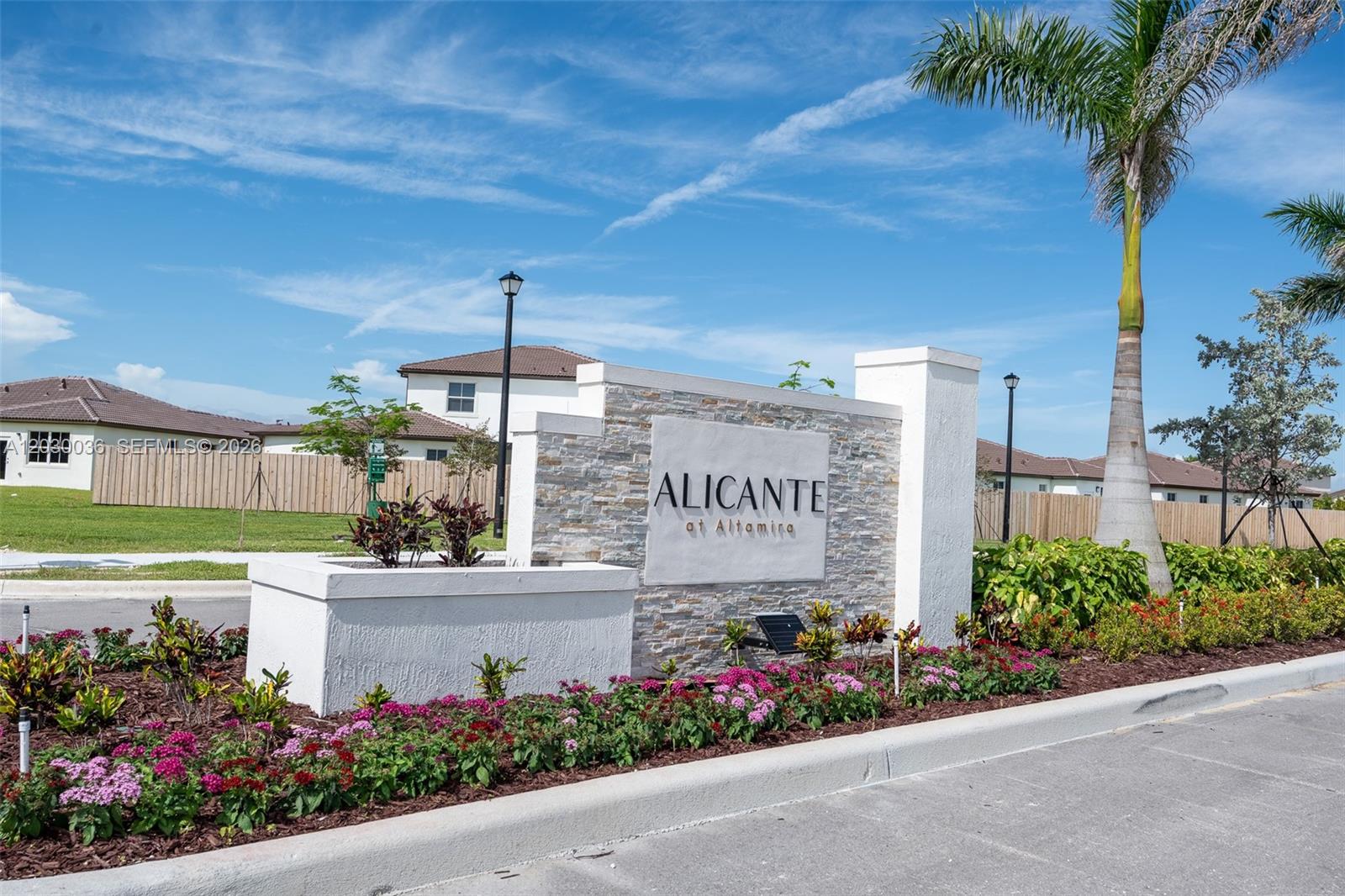 A stone monument sign for Alicante at Altamira stands in a landscaped residential entrance — 2485 SE 29th Dr, Homestead FL 33035, HOMESTEAD, FL