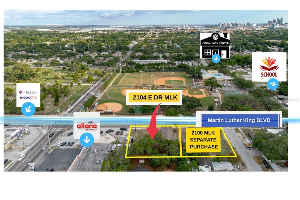 An aerial view shows a commercial lot with a building and adjacent vacant land — 2104 E DR MLK, TAMPA, FL