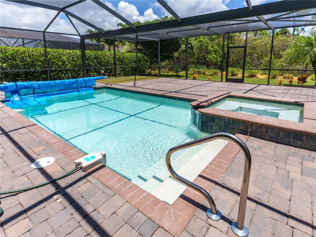 This is a two-story floor plan showing a house with a pool and a garage — 1588 VIZCAYA LANE, NAPLES, FL