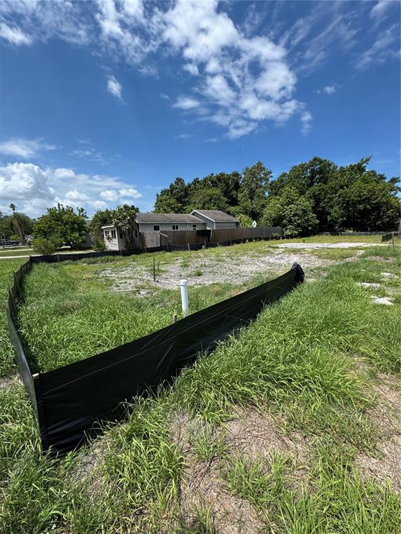 A vacant residential lot with a silt fence and a concrete foundation slab — 4240 40TH STREET N, ST PETERSBURG, FL