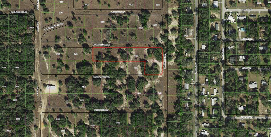 This is an aerial map showing a vacant lot outlined in red — 2357 E FOX CROSSING LANE, INVERNESS, FL