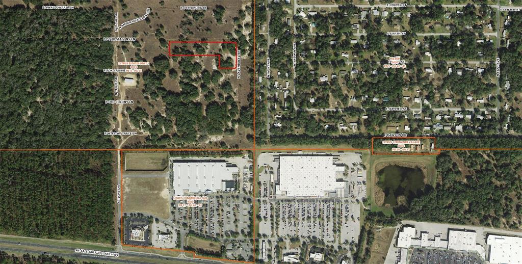 This aerial map shows commercial and residential properties with highlighted land parcels and surrounding roads — 2357 E FOX CROSSING LANE, INVERNESS, FL